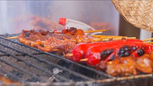Skewers and sausages grilled on the street