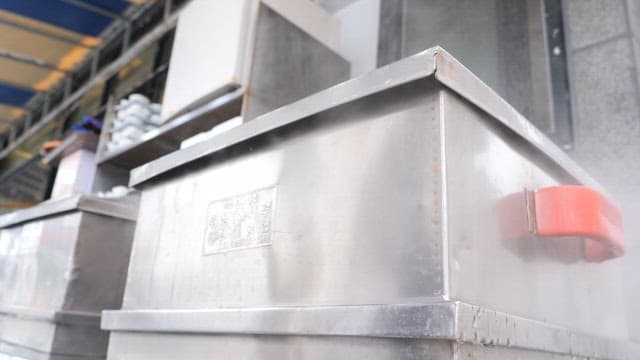 Food steaming in metal steamer at an outdoor market