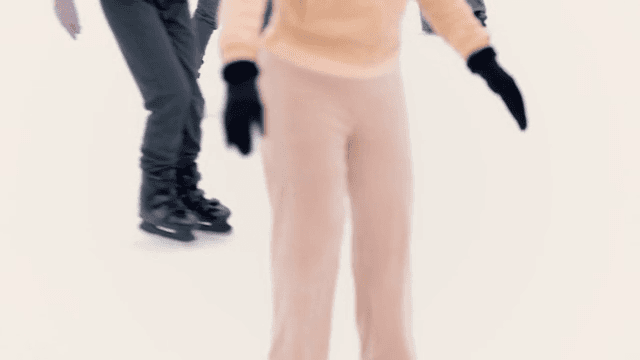 People ice skating at a rink