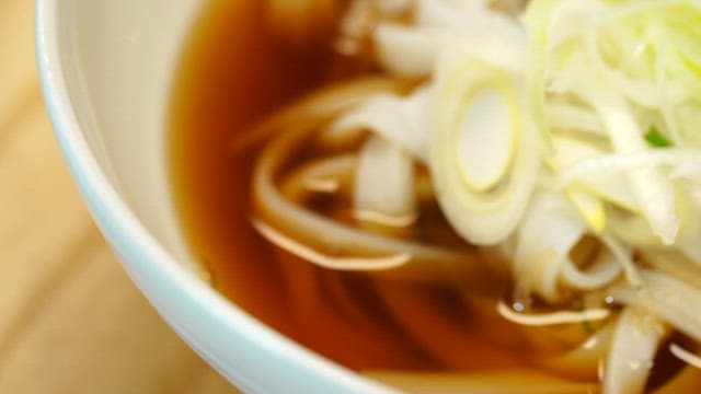Bowl of Garakguksu with sliced green onions