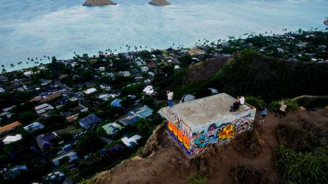People Enjoying Ocean View from Hilltop