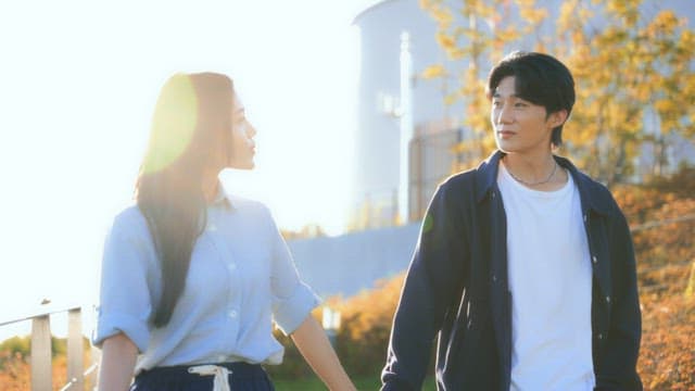 Couple walking hand in hand on a sunny day