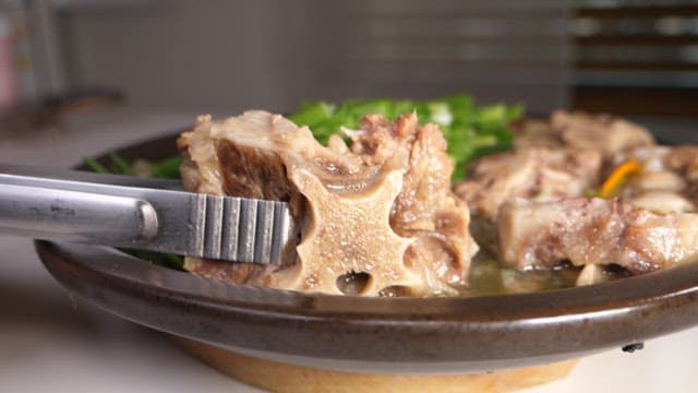 Spoonful of warm and hearty oxtail soup