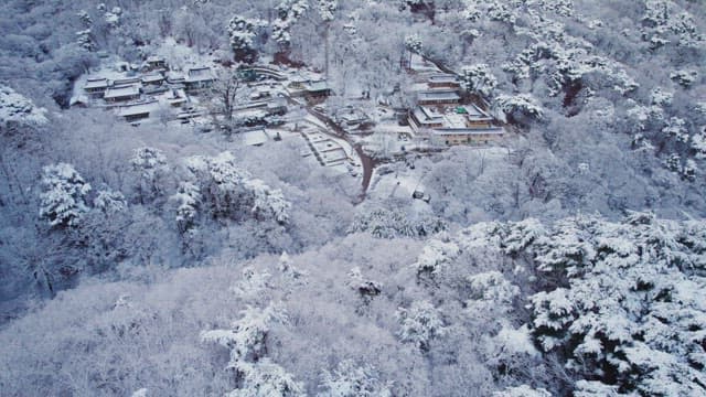 Snow-covered traditional Korean temple