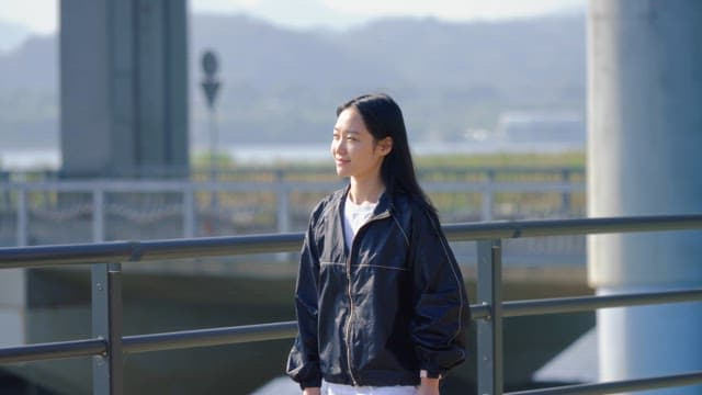 Woman drinking water while walking