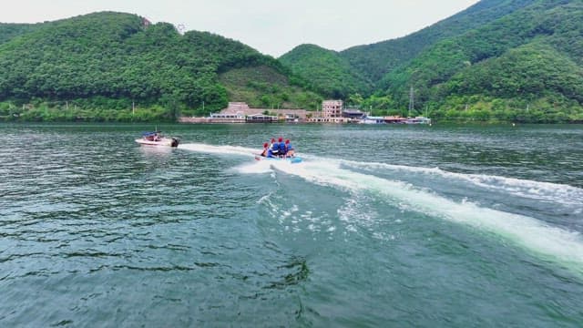 People enjoying a banana boat ride on a river