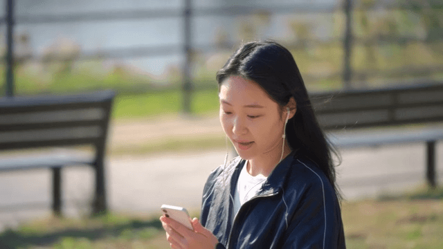 Woman listening to music outdoors