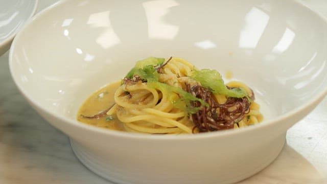 Bowl of pasta with seaweed and sauce