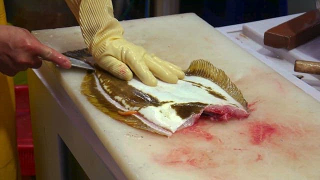 Preparing Fish at a Seafood Market