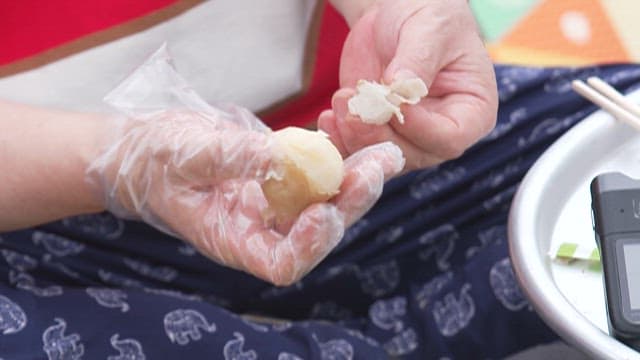 Hand Peeling Boiled Potatoes