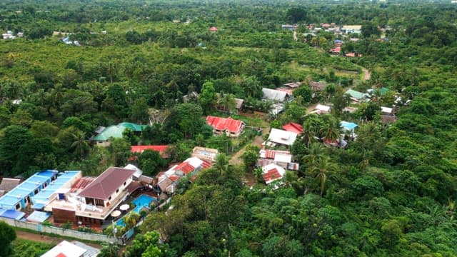 Village surrounded by lush greenery