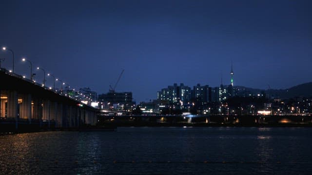Dusk View of City Skyline and River