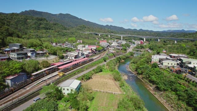 Scenic village with a train passing by