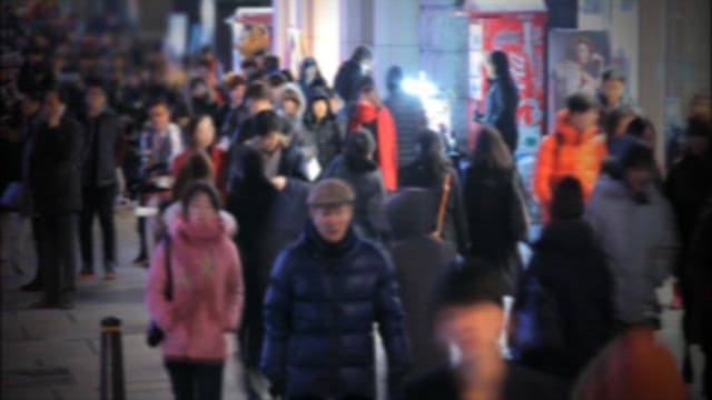 Bustling Street Scene in Urban Evening