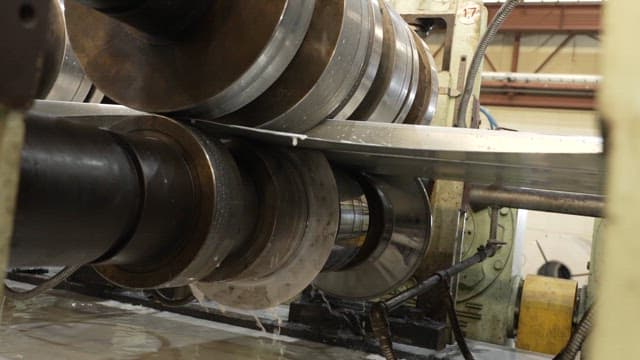 Metal sheet being processed in a factory