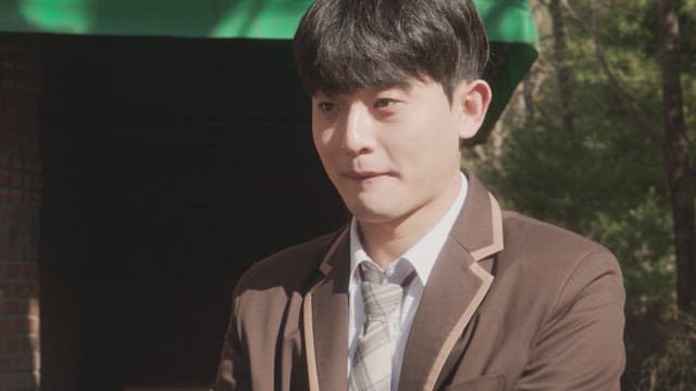 Male student wearing a school uniform shyly confessing