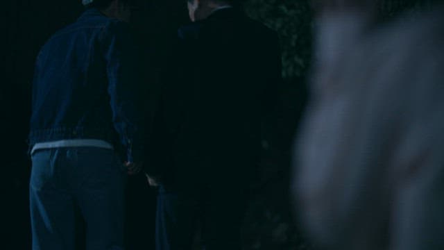 Woman Secretly Watching the Meeting of Two Men