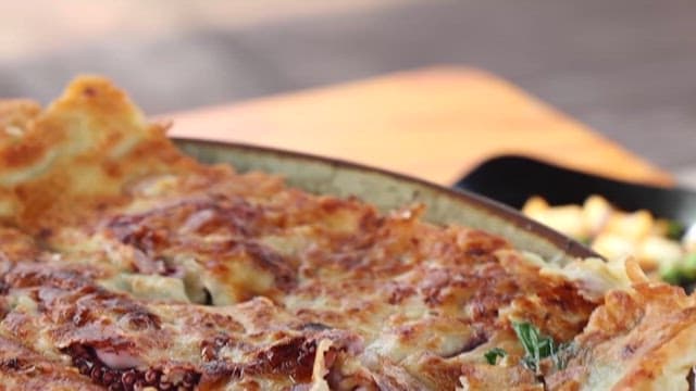 Seafood and green onion pancakes on a plate