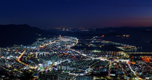 Day to night views of the city along the coastline