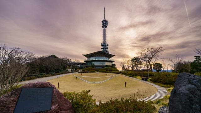 Tower with a garden at sunset