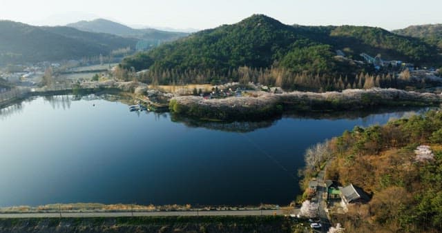 Serene lake surrounded by lush green mountains