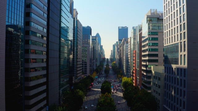 Bustling city street lined with skyscrapers