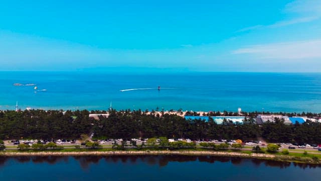 Coastal road with a view of the blue sea and greenery