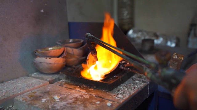 Artisan Heating Metal in a Forge