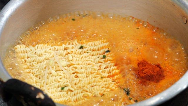 Instant noodles boiling in a pot