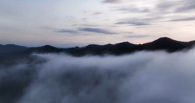 Mountains shrouded in early morning mist