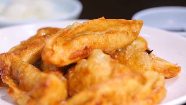 Crispy golden fried dumplings on a plate