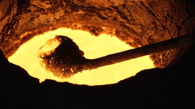 Molten metal being stirred in a furnace