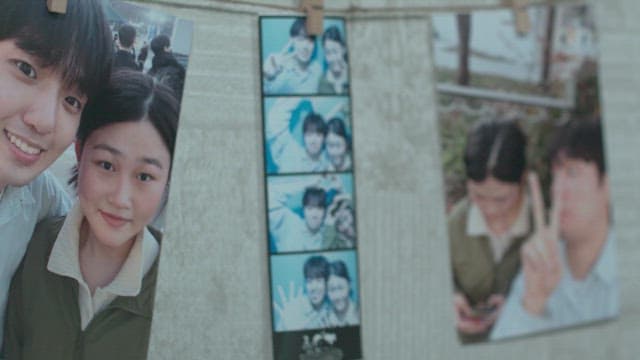 Photos of a friendly couple hanging on the wall