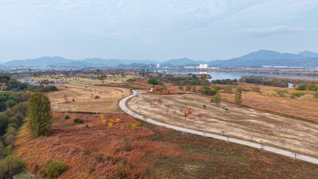 Serene river landscape with distant city
