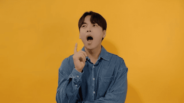 Man raising index finger after realizing something