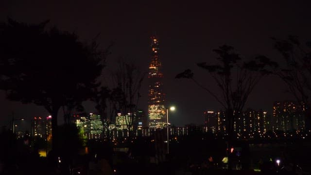 Night cityscape with illuminated high-rise buildings