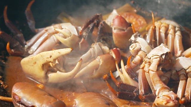 Crabs cooking in a steaming pot