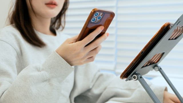 Woman using smartphone indoors