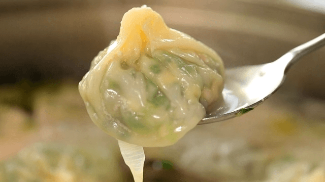 Dumplings boiling in a chicken soup