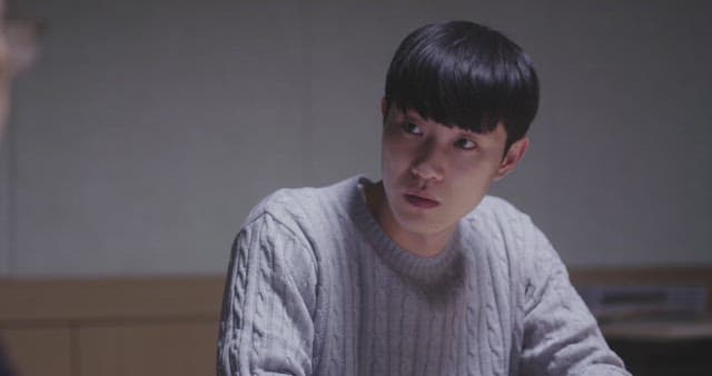 Man lowering his head with a disappointed expression