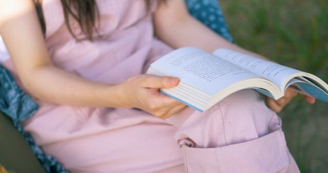 Woman Dropping the Book She was Reading