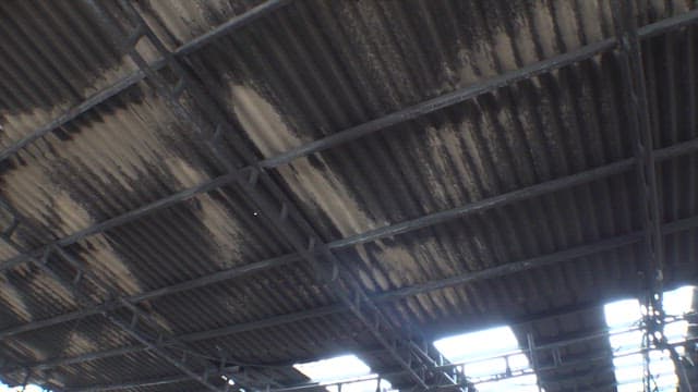 Ashes and hardware piled up at the scene of a fire