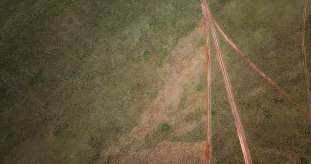 View of intersecting dirt roads