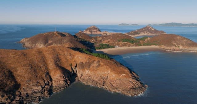 Serene Coastal Landscape with Hills and Sea