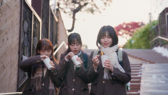 Students eating tteokbokki in winter