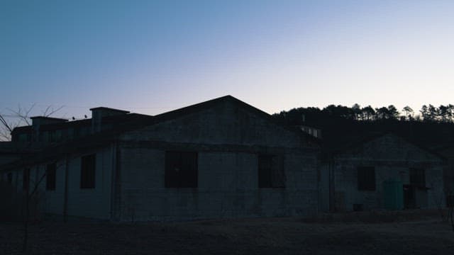 Warehouses in the Darkness of Twilight