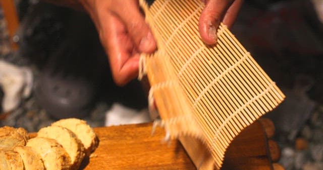 Preparing Grated Dish on Bamboo Mat