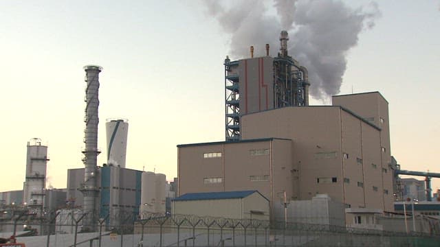 Industrial Plant Emitting Smoke at Dusk