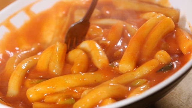 Sweet and Spicy Tteokbokki Served in a White Plate