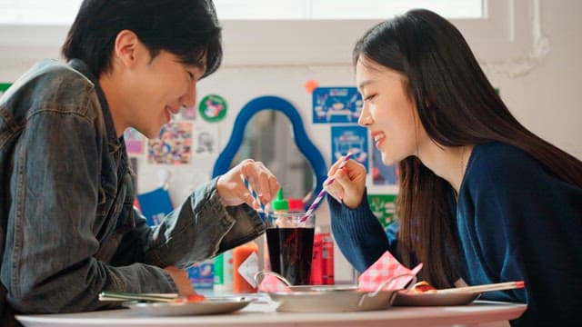 Couple enjoying cola together